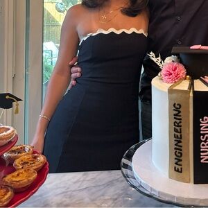 Black mini dress with white trim